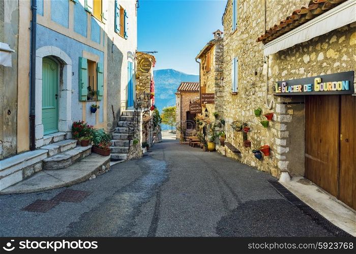 GOURDON, FRANCE - OCTOBER 31, 2014: Narrow cobbled streets with flowers in the old village
