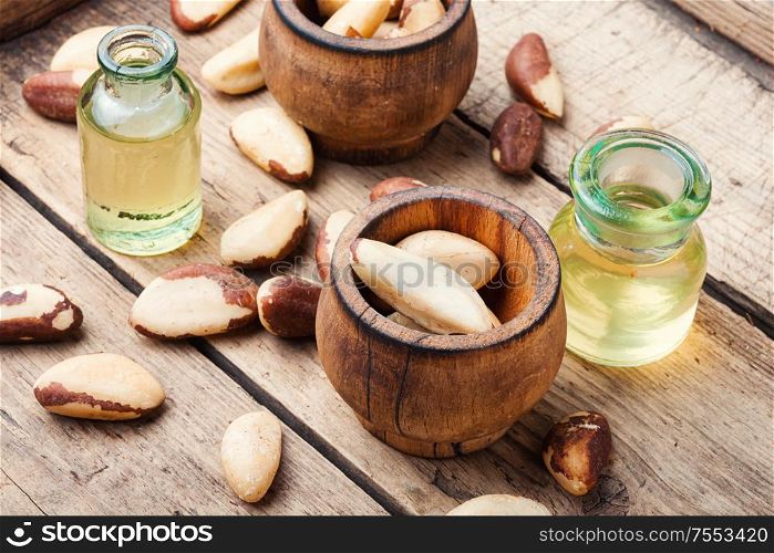 Gourmet peeled Brazil nut and jars of oil.. Brazil nut or Bertholletia
