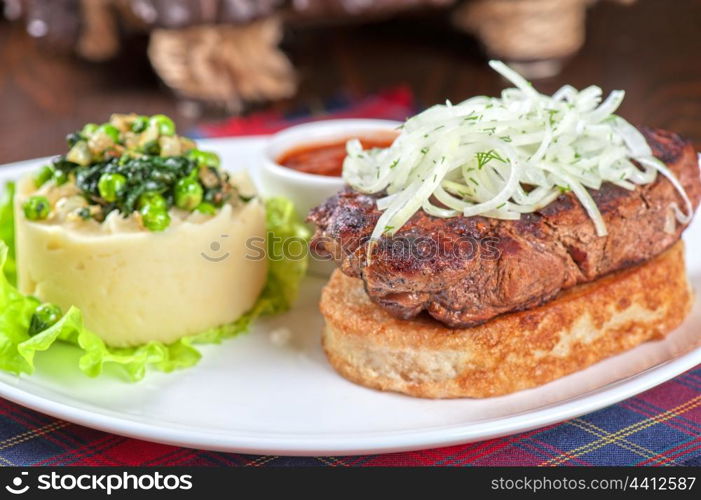 Gourmet steak meat with potato, vegetables and sauce