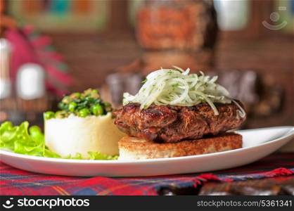 Gourmet steak meat with potato, vegetables and sauce
