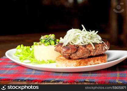 Gourmet steak meat with potato, vegetables and sauce