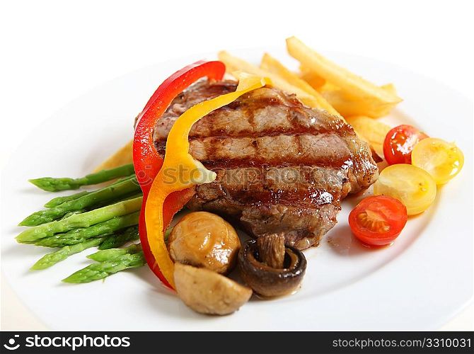 Gourmet style veal sirloin steak, served with asparagus, grilled mushrooms, cherry tomatos, ribbons of red and yellow capsicum and fries.