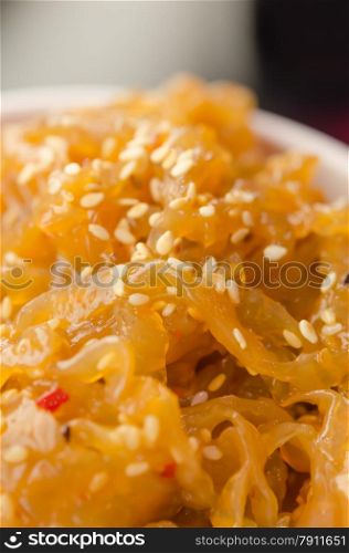 gourmet tossed jellyfish salad in white bowl , Chinese cuisine