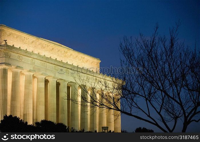 Government building lit up at night, Washington DC, USA