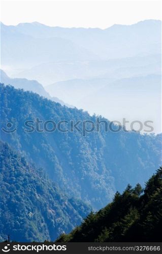 Gradation mountains with light fog in the morning