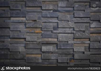 Gradient light on surface of gray stone slate wall background in vintage tone style