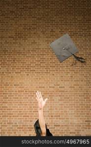 Graduate throwing their mortar board