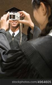 Graduates taking photographs