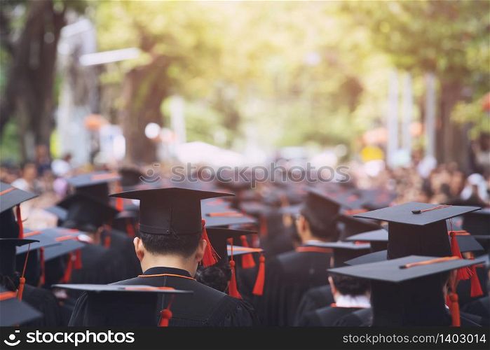 Graduation Cap Of Front male Graduate In Commencement Ceremony Row