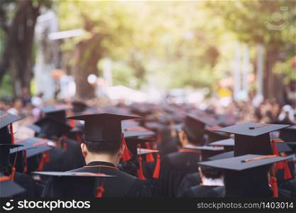 Graduation Cap Of Front male Graduate In Commencement Ceremony Row