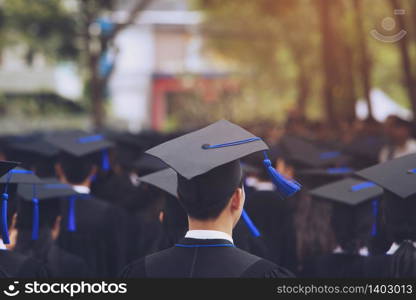 Graduation cap of front man graduate in commencement ceremony row