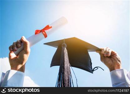 Graduation day, Images of graduates are celebrating graduation put hand up, a certificate and a hat in hand, Happiness feeling, Commencement day, Congratulation