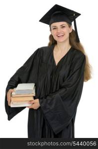 Graduation female student holding stack of books