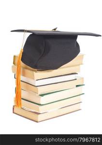Graduation Hat with books isolated on white