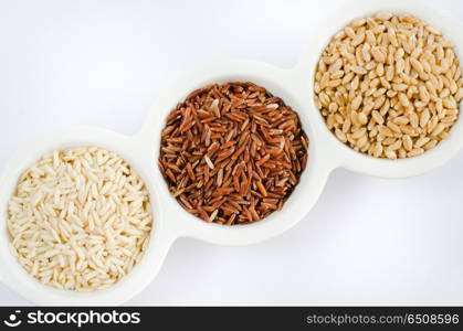 Grain and Cereal Set , rice , red rice , wheat over white bowl