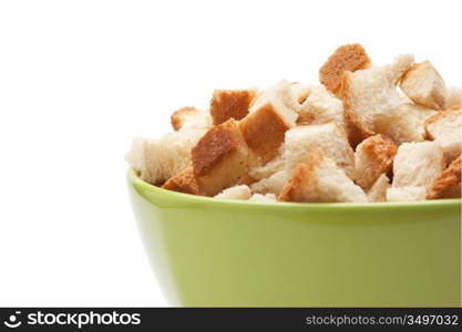 grain crackers in green bowl isolated on white background