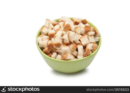 grain crackers in green bowl isolated on white background
