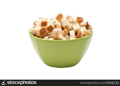 grain crackers in green bowl isolated on white background