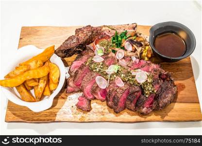 Grain fed Grilled Tomahawk Beef steak with fried potato wedge