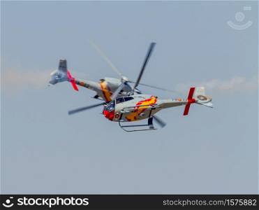 GRANADA, SPAIN-MAY 18: Helicopters of the Patrulla Aspa taking part in a exhibition on the X Aniversary of the Patrulla Aspa of the airbase of Armilla on May 18, 2014, in Granada, Spain. Patrulla Aspa