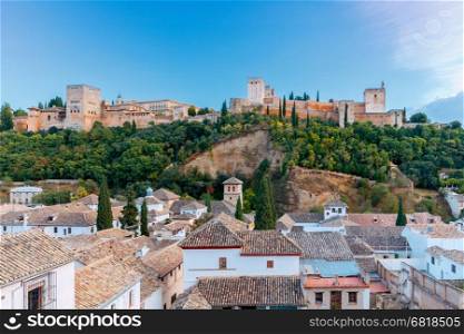 Granada. The fortress and palace complex Alhambra.. Walls and towers of the fortress of the Alhambra at sunset in Granada. Andalusia. Spain.