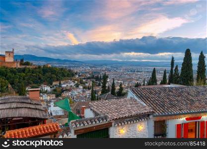 Granada. The fortress and palace complex Alhambra.. Walls and towers of the fortress of the Alhambra at sunset in Granada. Andalusia. Spain.