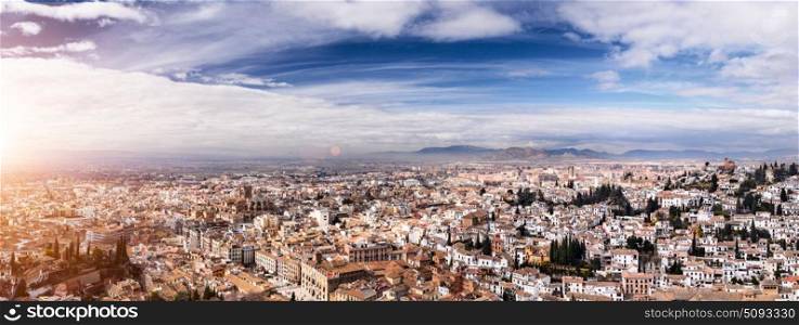 Granada view Andalucia, Espana. Panoramic view of Granada city against mountains, Andalusia, Spain