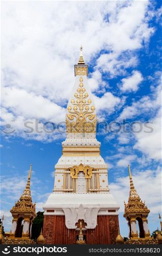 Grand ancient pagoda of Wat Phra That Phanom against sky, most sacred temple of Nakhon Phanom - Thailand