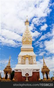 Grand ancient pagoda of Wat Phra That Phanom against sky, most sacred temple of Nakhon Phanom - Thailand