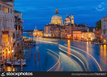 Grand canal and The Basilica of St Mary of Health or Basilica di Santa Maria della Salute at night in Venice, Italy