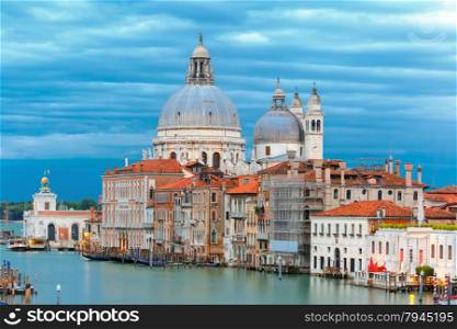 Grand canal and The Basilica of St Mary of Health or Basilica di Santa Maria della Salute at twilight in Venice, Italy