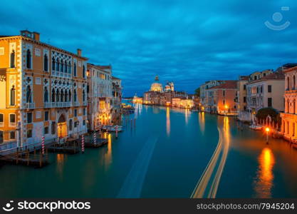 Grand canal and The Basilica of St Mary of Health or Basilica di Santa Maria della Salute at night in Venice, Italy