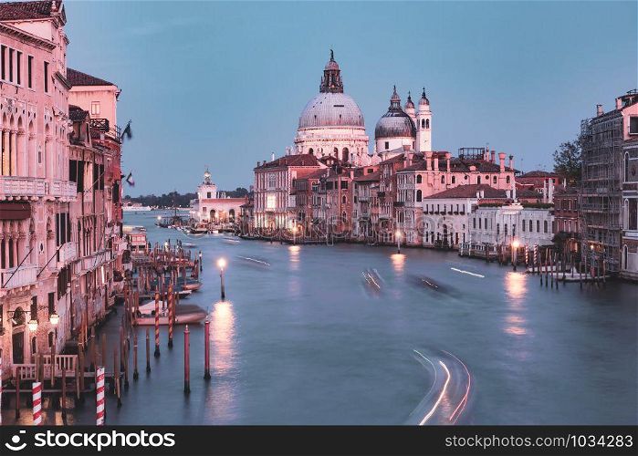 Grand canal and The Basilica of St Mary of Health or Santa Maria della Salute at sunset in Venice, Italy. Santa Maria della Salute, Venice