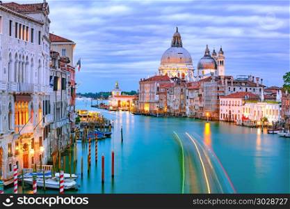 Grand canal at night in Venice, Italy. Grand canal and The Basilica of St Mary of Health or Basilica di Santa Maria della Salute at night in Venice, Italy