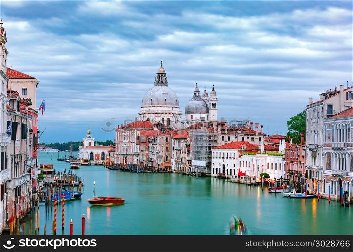 Grand canal at night in Venice, Italy. Grand canal and The Basilica of St Mary of Health or Basilica di Santa Maria della Salute at night in Venice, Italy