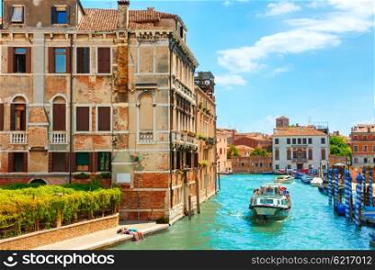 Grand Canal in Venice with houses and traveling people on voat