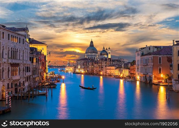 Grand Canal of Venice with a lonely gandolier at sunset, Italy.