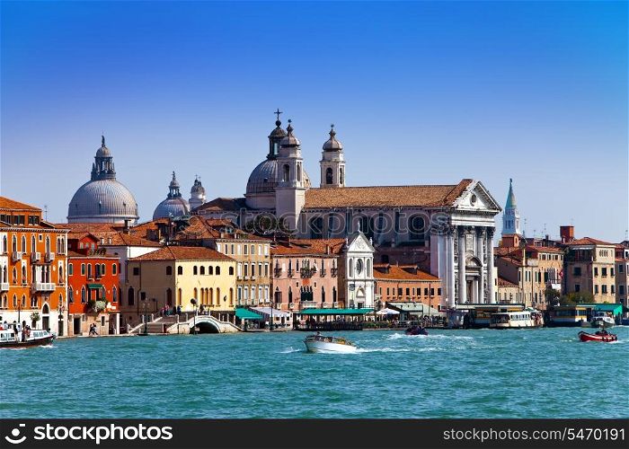 Grand Canal with boats and Basilica Santa Maria della Salute, Venice, Italy