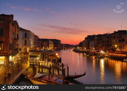 Grand Canal with gondolas in Venice, Italy. Sunset view of Venice Grand Canal. Architecture and landmarks of Venice. Venice postcard