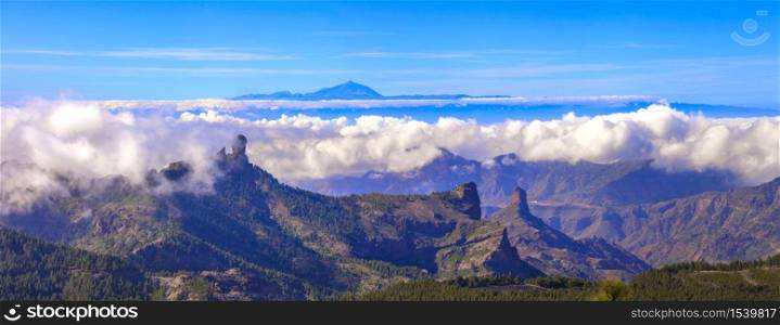 Grand Canary island. Mirador Roque Nublo . Breathtaking mountains over sunset and view of Tenerife .. Gran Canaria mountains over clouds. Canary islands of Spain