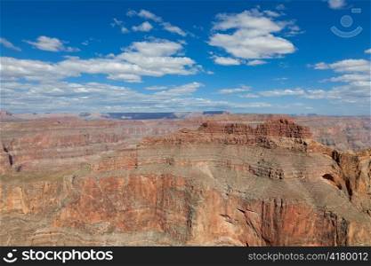 Grand canyon in sunny day with blue sky and clouds