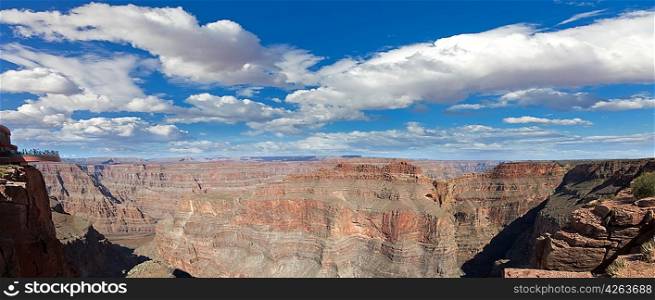Grand canyon panorama in sunny day with blue sky and clouds