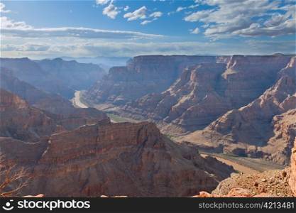Grand canyon with Colorado river view, blue sky and clouds