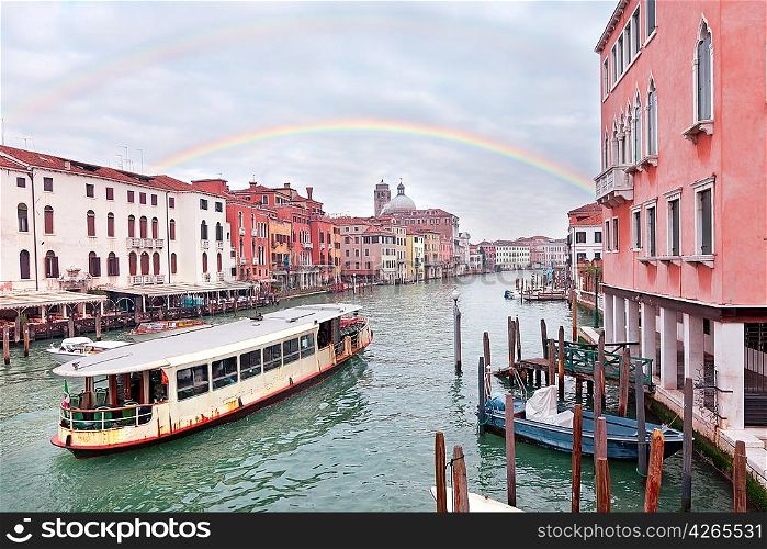 Grand channel in Venice with sailing motor boats and building exteriors