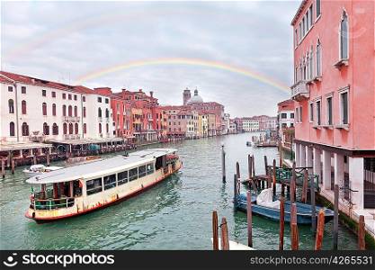 Grand channel in Venice with sailing motor boats and building exteriors