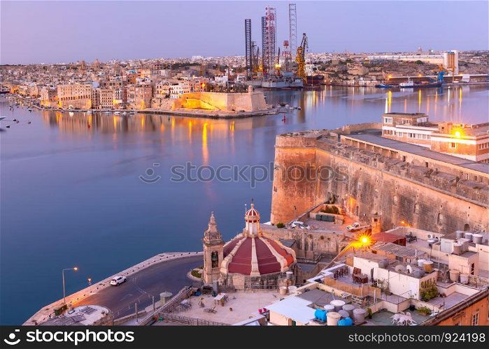 Grand Harbor and Senglea - one of Three cities, Church of Our Lady of Liesse on Quay of Valletta at dawn, Malta.. Grand Harbor of Valletta at dawn. Malta.