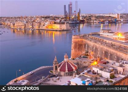 Grand Harbor and Senglea - one of Three cities, Church of Our Lady of Liesse on Quay of Valletta at dawn, Malta.. Grand Harbor of Valletta at dawn. Malta.