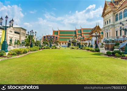 Grand Palace complex, green lawn in front of Chakri Maha Prasat Throne Hall. Bangkok, Thailand