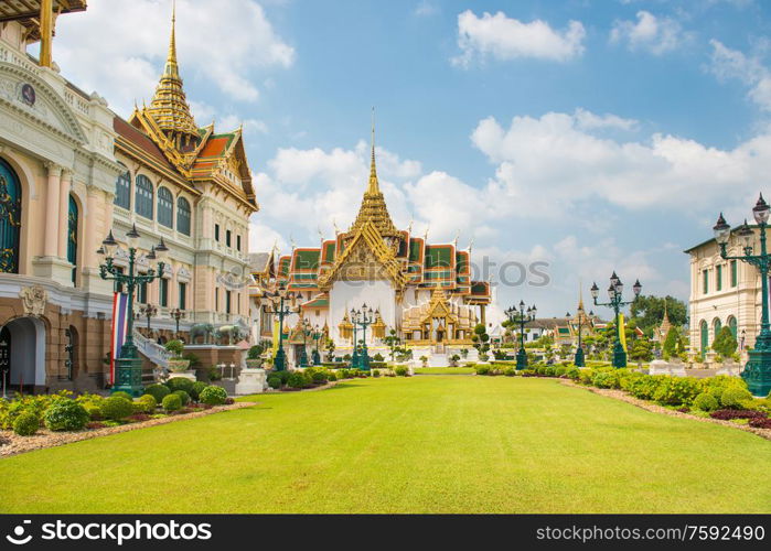 Grand Palace complex, view to Chakri Maha Prasat Throne Hall and Dusit Maha Prasat Hall. Bangkok, Thailand.