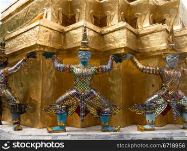 Grand Palace in Bangkok Thailand with dancing demons holding up roof